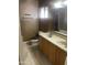 Spacious bathroom features double sinks, wood vanity, and a shower-tub combo at 405 E Providence Dr, Casa Grande, AZ 85122