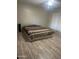 Bedroom featuring wood floors, neutral paint, queen sized bed and a closet at 405 E Providence Dr, Casa Grande, AZ 85122