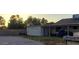 Cozy single-story home features a detached garage and covered carport at 405 E Providence Dr, Casa Grande, AZ 85122
