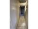 Hallway featuring tile flooring and a neutral wall paint at 405 E Providence Dr, Casa Grande, AZ 85122