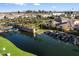 Community lake with waterfalls, landscaping and community name monument at 4050 S Thistle S Dr, Chandler, AZ 85248
