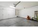 Spacious garage with epoxy floors and ample storage cabinets along the wall at 4050 S Thistle S Dr, Chandler, AZ 85248