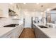 Elegant kitchen boasting white cabinets, stainless steel appliances, and a functional layout for cooking and entertaining at 4050 S Thistle S Dr, Chandler, AZ 85248