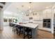 Modern kitchen with a large center island, pendant lighting, and stainless steel appliances at 4050 S Thistle S Dr, Chandler, AZ 85248