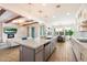 Stylish kitchen with modern fixtures, a large island, and an open layout connecting to the living and dining areas at 4050 S Thistle S Dr, Chandler, AZ 85248