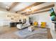 Spacious living room flowing into the kitchen, featuring stylish furnishings and bright natural light at 4050 S Thistle S Dr, Chandler, AZ 85248