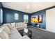 Comfortable living room features a large sectional couch and a wall-mounted TV at 4050 S Thistle S Dr, Chandler, AZ 85248