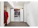 Walk-in closet with shelves and drawers in a neutral color scheme at 4050 S Thistle S Dr, Chandler, AZ 85248