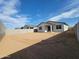 Spacious backyard with block fence and room for personalization, perfect for outdoor activities at 4167 W Lisa Ln, San Tan Valley, AZ 85144
