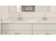 Modern bathroom highlights double sinks, large mirrors and clean white cabinetry in bright, neutral space at 4167 W Lisa Ln, San Tan Valley, AZ 85144