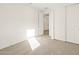 Large bedroom features neutral carpet, a double-door closet and view into hallway at 4167 W Lisa Ln, San Tan Valley, AZ 85144