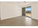 Open dining area with tile floors, modern chandelier, and sliding glass doors leading to backyard at 4167 W Lisa Ln, San Tan Valley, AZ 85144
