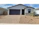 Charming single-story home featuring a two-car garage and low-maintenance landscaping in front at 4167 W Lisa Ln, San Tan Valley, AZ 85144