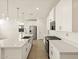 Spacious kitchen with a large island, stainless steel appliances, and white cabinetry at 4167 W Lisa Ln, San Tan Valley, AZ 85144