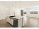 Bright and open kitchen island with stainless steel dishwasher, sink and pendant lighting at 4167 W Lisa Ln, San Tan Valley, AZ 85144