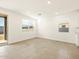 Bright living room featuring tile flooring, recessed lighting, and multiple windows for ample natural light at 4167 W Lisa Ln, San Tan Valley, AZ 85144