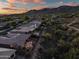Desert home featuring a luxurious back patio, desert landscaping, and mountain views at 41731 N Rolling Green Way, Anthem, AZ 85086