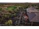 Aerial view of a home with a well-manicured golf course in the background at 41731 N Rolling Green Way, Anthem, AZ 85086