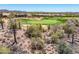 Scenic view of lush golf course and desert landscaping, nestled among beautiful mountain views at 41731 N Rolling Green Way, Anthem, AZ 85086