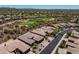 Residential aerial showcasing desert homes with manicured landscaping and a nearby golf course at 41731 N Rolling Green Way, Anthem, AZ 85086