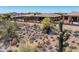 Backyard featuring cacti, desert landscaping, mountain views, and privacy wall at 41731 N Rolling Green Way, Anthem, AZ 85086