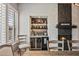 The bar area offers ample storage and a convenient wine cooler, great for entertaining guests at 41731 N Rolling Green Way, Anthem, AZ 85086