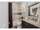 Well-lit bathroom with a tub, granite countertop vanity, and decorative mirrors at 41731 N Rolling Green Way, Anthem, AZ 85086