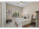Inviting bedroom with cozy decor, shutters, and soft neutral tones at 41731 N Rolling Green Way, Anthem, AZ 85086