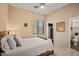 Comfortable bedroom featuring a ceiling fan, closet, and window with shutters at 41731 N Rolling Green Way, Anthem, AZ 85086