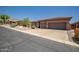 Well maintained home with three-car garage and low maintenance desert landscaping, situated on a quiet street at 41731 N Rolling Green Way, Anthem, AZ 85086