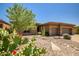 Charming single-story home with desert landscaping, a three-car garage and inviting curb appeal at 41731 N Rolling Green Way, Anthem, AZ 85086