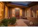 Inviting front porch with desert landscaping, providing a cozy and private entrance at 41731 N Rolling Green Way, Anthem, AZ 85086