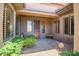 Cozy front porch with desert landscaping and tasteful accents creating a welcoming entrance to the home at 41731 N Rolling Green Way, Anthem, AZ 85086