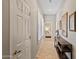 Hallway view with tiled floor and shuttered window at 41731 N Rolling Green Way, Anthem, AZ 85086