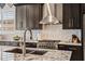 Updated kitchen featuring stainless steel appliances, granite counters, and stylish backsplash at 41731 N Rolling Green Way, Anthem, AZ 85086