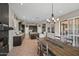 Spacious kitchen features an island, bar, and ample counter space for all of your cooking needs at 41731 N Rolling Green Way, Anthem, AZ 85086