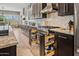 Kitchen with open spice rack drawers, stainless steel appliances, and granite countertops at 41731 N Rolling Green Way, Anthem, AZ 85086