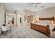 Large main bedroom with a bed, neutral walls, and carpet at 41731 N Rolling Green Way, Anthem, AZ 85086