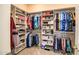 Walk-in closet with ample storage and custom organization systems at 41731 N Rolling Green Way, Anthem, AZ 85086