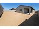 Expansive backyard space with block fencing, offering privacy and potential for outdoor activities at 4211 W Lisa Ln, San Tan Valley, AZ 85144