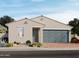 Charming single-story home showcasing a neutral color palette, desert landscaping, and a two-car garage at 4211 W Lisa Ln, San Tan Valley, AZ 85144