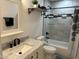 Charming bathroom featuring marble-look vanity, black fixtures, and decorative tiled tub-shower at 4602 N 47Th N Ave, Phoenix, AZ 85031