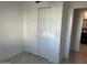 This bedroom features a closet with white doors and modern wood-look flooring at 4602 N 47Th N Ave, Phoenix, AZ 85031