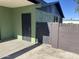 A covered outdoor space featuring a secured entry door and a side gate enhances the functionality of this green property at 4602 N 47Th N Ave, Phoenix, AZ 85031