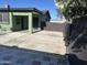 A charming green home featuring a covered entry, private patio, and a well-maintained exterior for a welcoming appeal at 4602 N 47Th N Ave, Phoenix, AZ 85031