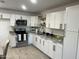 Bright kitchen featuring white cabinets, granite countertops and stainless steel appliances at 4602 N 47Th N Ave, Phoenix, AZ 85031