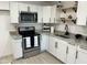 Bright kitchen featuring white cabinets, granite countertops and stainless steel appliances at 4602 N 47Th N Ave, Phoenix, AZ 85031
