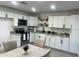 Bright kitchen featuring white cabinets, granite countertops and stainless steel appliances, eat-in table at 4602 N 47Th N Ave, Phoenix, AZ 85031