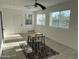 A bright and airy living room with a rug and a dining table at 4602 N 47Th N Ave, Phoenix, AZ 85031