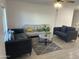 Inviting living room with modern furnishings, plush sofas, a stylish rug, and neutral decor, creating a comfortable living space at 4602 N 47Th N Ave, Phoenix, AZ 85031